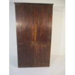 A pine four door cupboard 213cm H 49cm D 113cm W