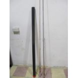 Two fishing rods, A Greys GRX 9'6 #7/8 and a split cane "Fishing Rod Japan". One in black tubing,