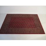 A Crossley red ground rug. Length 232cm, width 160cm.