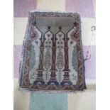 A prayer rug decorated with minarets A/F. Overall size 78cm x 57cm