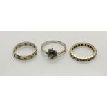 A small 9ct gold eternity ring along with an unmarked diamond dress ring and a silver and 9ct gold