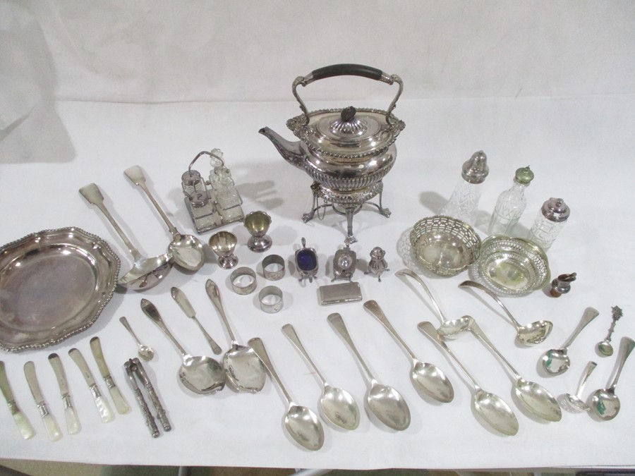 A collection of various silver plated items including spirit kettle on stand, napkin rings,