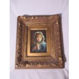 An unsigned oil of a Dutch young girl in gilt frame- overall size 37cm x 32cm