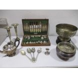 An assortment of silver plated items including large ornamental bowl, a pair of trumpet vases,