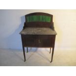 A vintage washstand with marble top, green tiled back and two doors - one leg A/F