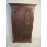 A two door panelled cupboard