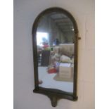 A gilt hanging wall mirror with shelf