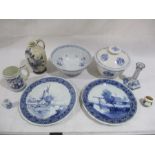 A collection of Dutch Delft blue and white china including a bowl, candlestick, jug, plates etc