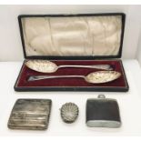 A hallmarked silver cigarette case (66.9g) along with a pair of cased berry spoons and a vesta