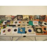 A collection of 7" vinyl singles including The Beatles (21 in total), The Rolling Stones (16),