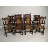 A set of eight Jacobean style carved oak dining chairs with cane seating