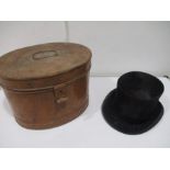 A hunting top hat in metal box by Tress & Co. London.