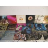 A collection of 12" vinyl records, mainly Canadian and American releases. Artist included Queen, The