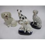 Four miniature Staffordshire dogs. Two with firing cracks.