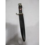 A vintage German boy scout knife in a steel scabbard
