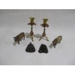 Two Elastolin cow figures A/F, along with a pair of brass and copper candlesticks and two wooden