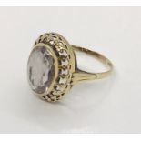A 9ct gold ring with pale amethyst