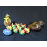 Two wooden trinket boxes in the form of ducks along with a collection of Easter chicken