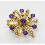 A 9ct gold brooch set with amethyst coloured stones and seed pearls