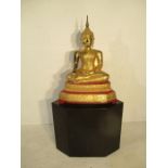A 19th century Thai gilded bronze sitting Buddha on bespoke marble plinth - overall height 150cm