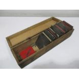 A collection of magic lantern slides in wooden case