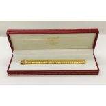A "Les Must de Cartier" cased gold plated ball point pen