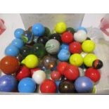 A collection of glass marbles in various sizes