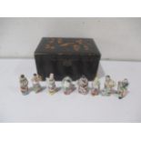 A Chinese lacquered box (A/F), along with a collection of Chinese figures