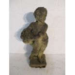 A concrete garden statue of a boy carrying a basket - height 75cm