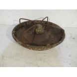 A cast iron animal feeding trough