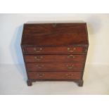 A Georgian mahogany bureau with four drawers