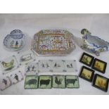 A collection of continental china including Quimper, a Portuguese meat platter, various tiles etc