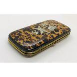 A Victorian tortoiseshell Etui case inlaid with silver. The empty case is lines with yellow silk. it