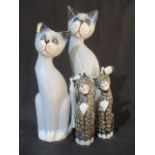 A collection of wooden cats.