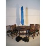 A teak garden table, along with six Danish Scancraft chairs, blue parasol and weighs