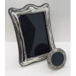 A hallmarked silver photo frame and one other