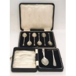 A cased set of hallmarked silver coffee spoons along with a cased Christening set