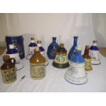 A collection of commemorative Wade whisky decanters including the birth of Princess Eugenie,