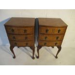 A pair of bow fronted bedside cabinets with three drawers