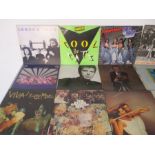 A collection of 12" vinyl records including Fleetwood Mac, Steely Dan, Neil Young, Elvis Costello.