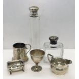 A small collection of hallmarked silver items including scent bottles, salt and jug etc.