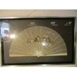 A framed fan, hand painted with birds