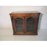 A Victorian Rosewood display cabinet with Acanthus leaf decoration
