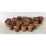 A collection of small terracotta pots