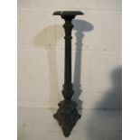 A cast iron Ecclesiastical candlestick with fluted column, height 69cm