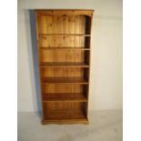 A pine freestanding bookshelf - height 182cm