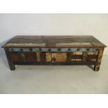 An Indian style coffee table with three drawers