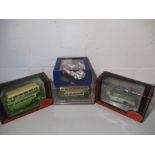 A collection of four die cast models including two exclusive first editions Leyland RTL Jersey Motor