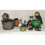 A collection of animal garden ornaments, a water feature etc
