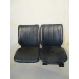 A pair of vintage car seats